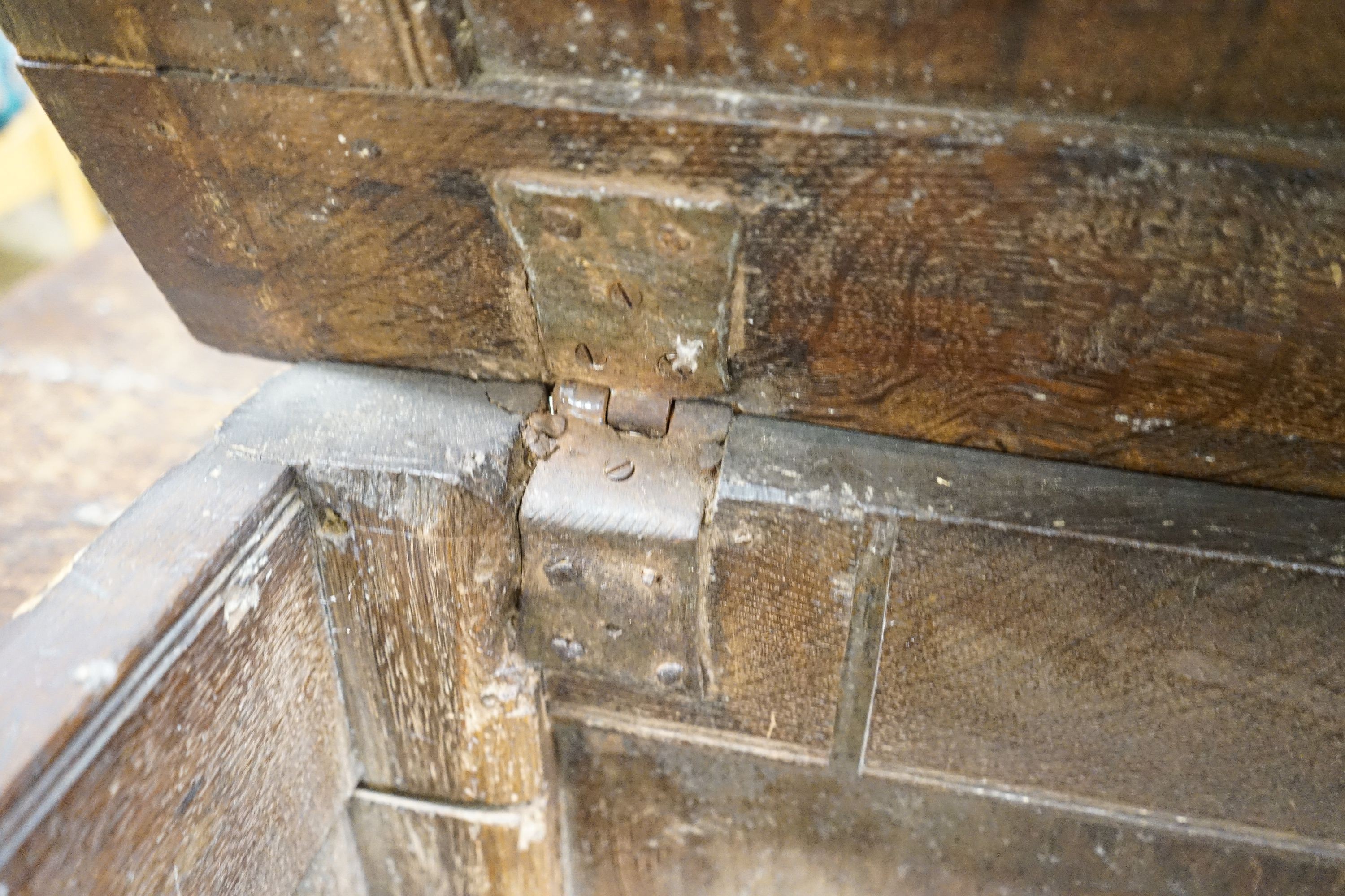 A late 17th century oak coffer, with four panel top and carved front, length 151cm, depth 58cm, height 69cm